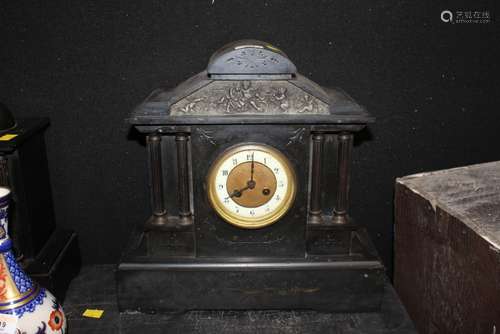 A 19th century black slate mantel clock of architectural des...