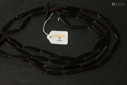 A simulated tortoiseshell two strand resin oval bead necklac...