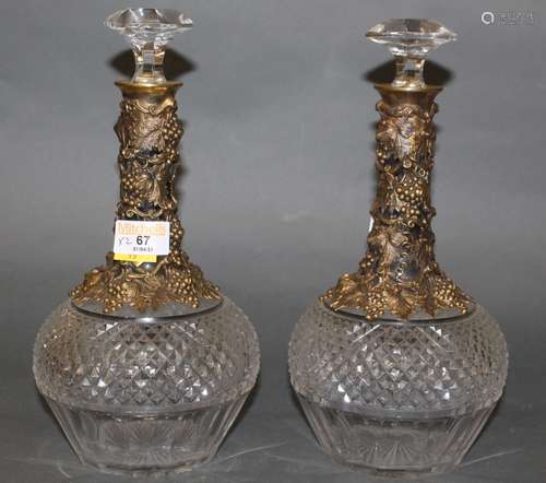 A pair of gilded white metal and cut glass bottle shaped dec...