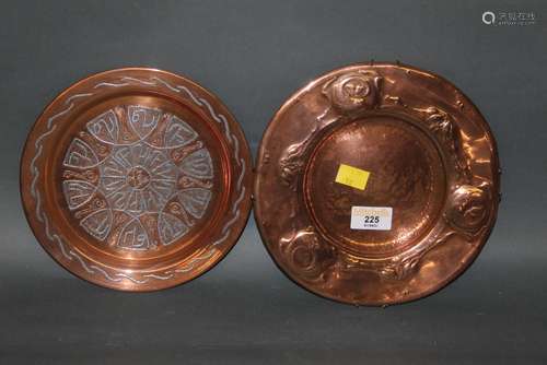 A copper circular plate of Arts and Crafts design embossed w...