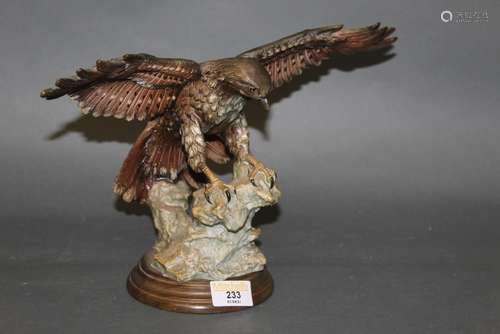 A Capodimonte resin figure of a sparrow hawk with wings outs...