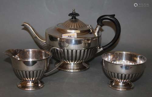 A silver plated three piece tea service, with circular gadro...