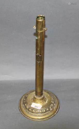 A large brass patent ejector candlestick, the plaque indisti...