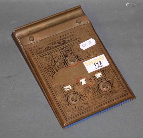 An engraved brass desk calendar/aid memoir issued by lighten...