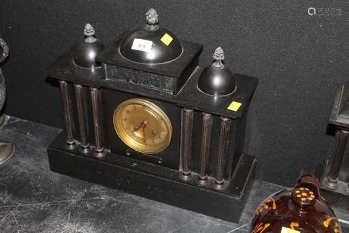 A 19th century black slate mantel clock of architectural des...