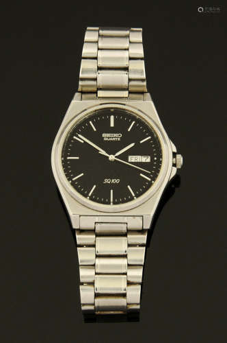 A vintage Seiko SQ100 stainless steel wristwatch, day date w...