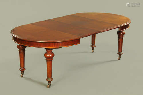 A Victorian mahogany extending dining table of moulded circu...