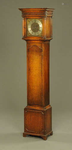 An oak grandmother clock,