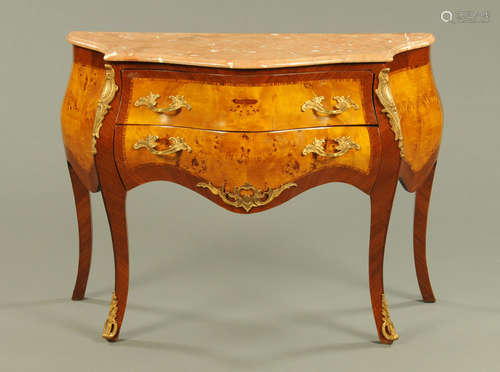 A Louis XV style walnut veneered commode, two drawer, with v...