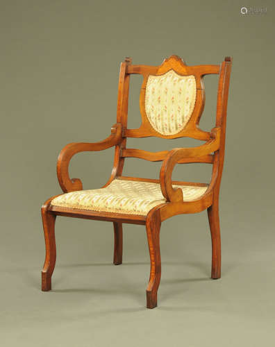 An Edwardian inlaid mahogany armchair, with scroll arms and ...