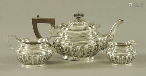 A three piece silver half lobed tea service, of small size, ...