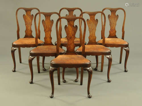 A set of six Queen Anne style walnut dining chairs, with sha...