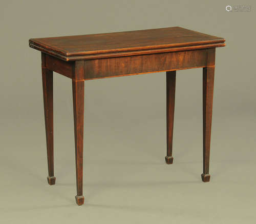 An early 19th century mahogany turnover top card table,