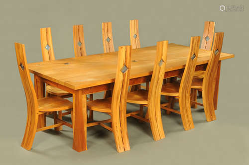 A craftsman made oak dining table by Danny Frost with ten ch...