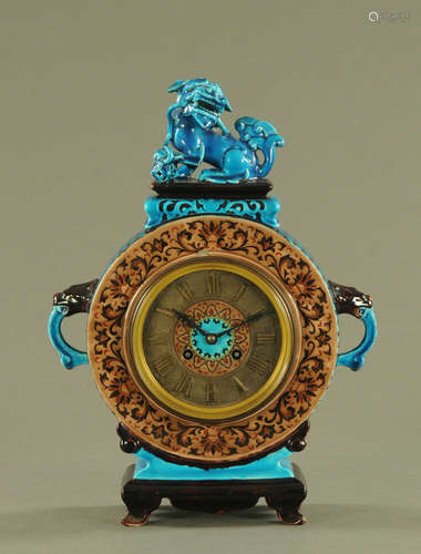 A 19th century French faience mantle clock,