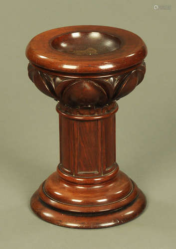 A Victorian mahogany font, with dished top and carved capita...