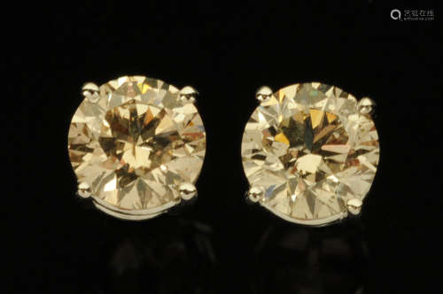 A pair of 18 ct white gold diamond stud earrings, total diam...