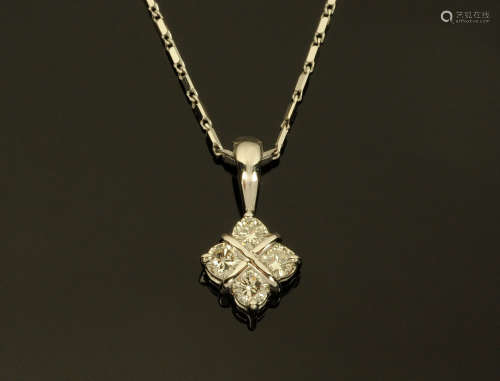 An 18 ct white gold pendant on chain, set with diamonds weig...