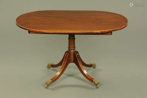 A 19th century mahogany breakfast table, with boxwood strung...