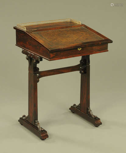 A rosewood Regency writing desk, with brass gallery,