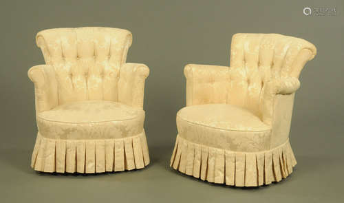 A pair of low deep buttoned bedroom chairs, of tub form,