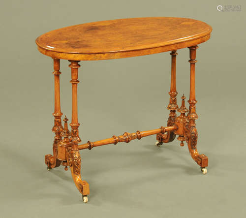 A Victorian walnut oval stretcher table,