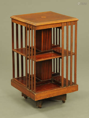 An Edwardian inlaid mahogany square revolving bookcase,