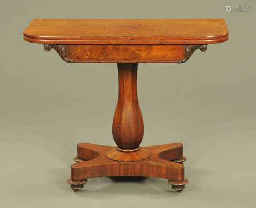 An early Victorian mahogany turnover top tea table, with wel...