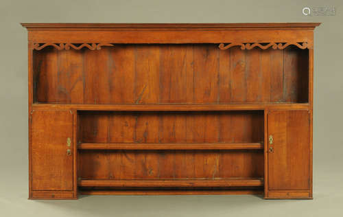 A George III oak Delft rack, with moulded cornice open shelv...