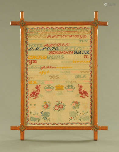 A Victorian sampler 1888, alphabet, vases and floral designs...