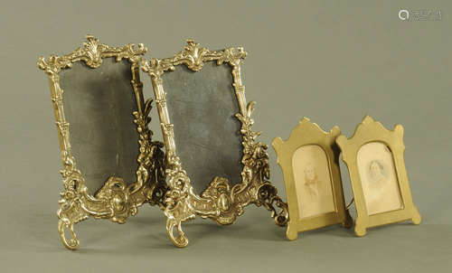 A pair of moulded brass photograph frames,