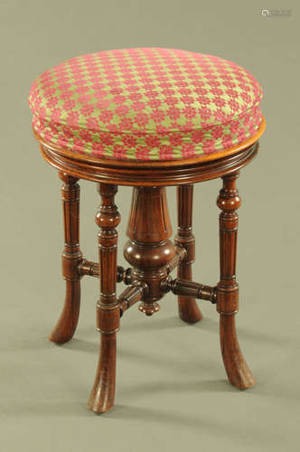 A Victorian mahogany piano stool, with rise and fall action,