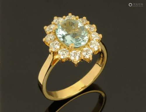 An 18 ct gold aquamarine and diamond cluster ring, aquamarin...
