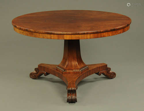 An early Victorian breakfast table, circular with faceted co...