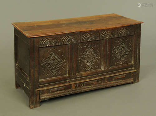 A late 17th century oak mule chest, with three panelled fron...