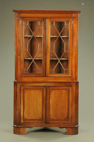 A George III mahogany standing corner cupboard,