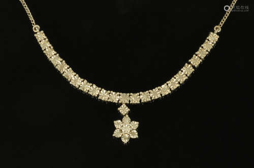 A silver illusion set diamond necklace with star pendant and...