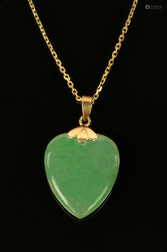 A 9 ct gold mounted green jade heart shaped pendant,