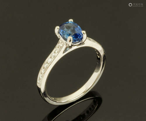 An 18 ct gold sapphire and diamond ring, sapphire +/- 1.25 c...