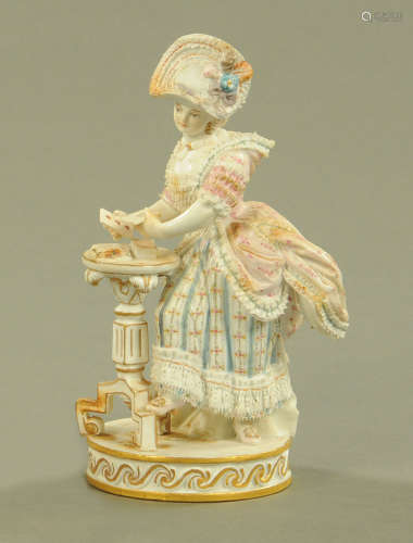 A Meissen figure of a female card player, 19th century after...