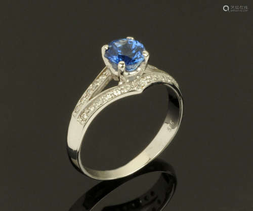 An 18 ct gold sapphire and diamond ring, sapphire +/- 1.10 c...