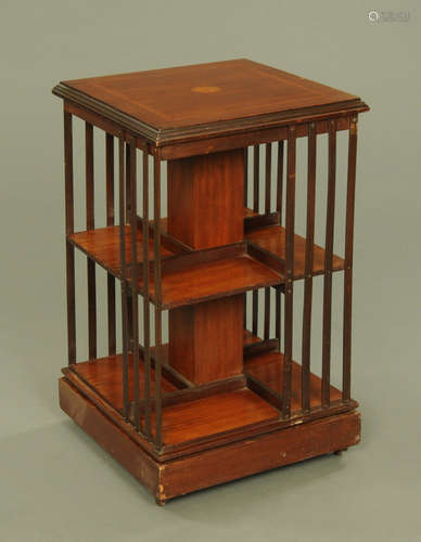 An Edwardian inlaid mahogany square revolving bookcase,