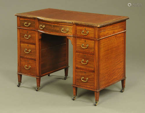 An Edwardian inlaid mahogany bowfronted desk,