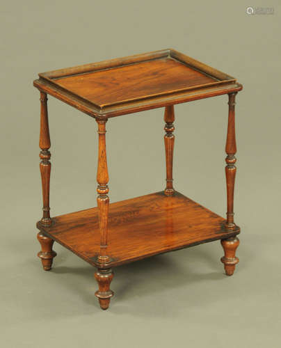 A small Victorian rosewood two tier whatnot stand, with turn...