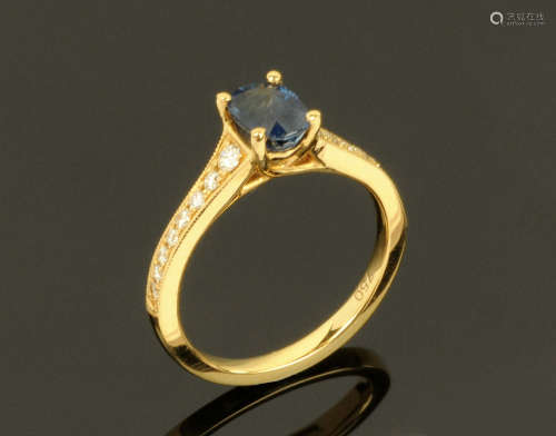An 18 ct gold sapphire and diamond ring, sapphire +/- 1.05 c...