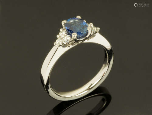 A platinum sapphire and diamond cluster ring, sapphire +/- 0...