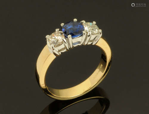 An 18 ct gold sapphire and diamond three stone ring, sapphir...
