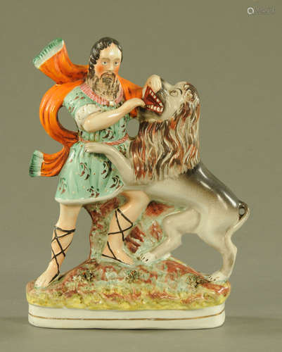 A 19th century Staffordshire figure, Hercules with Lion. Hei...