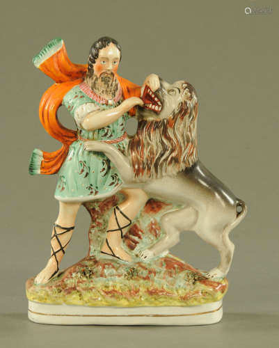 A 19th century Staffordshire figure, Hercules with Lion. Hei...