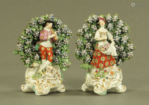 A pair of Derby figures, shepherd and shepherdess with flora...